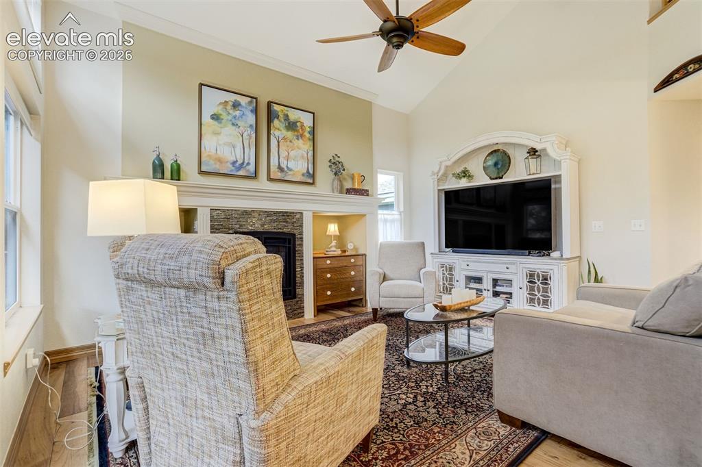 Image 15 of 50: Family room features vaulted ceilings and a gas fireplace.