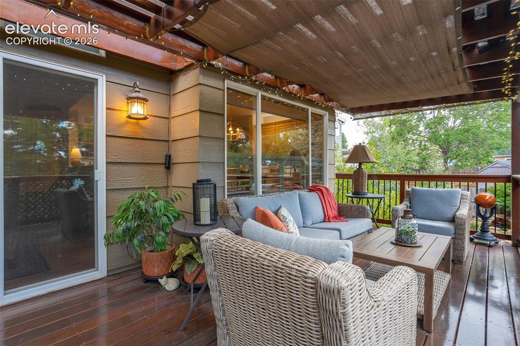 Image 36 of 50: Massive back deck made from Brazilian hardwood also features a pergola conv