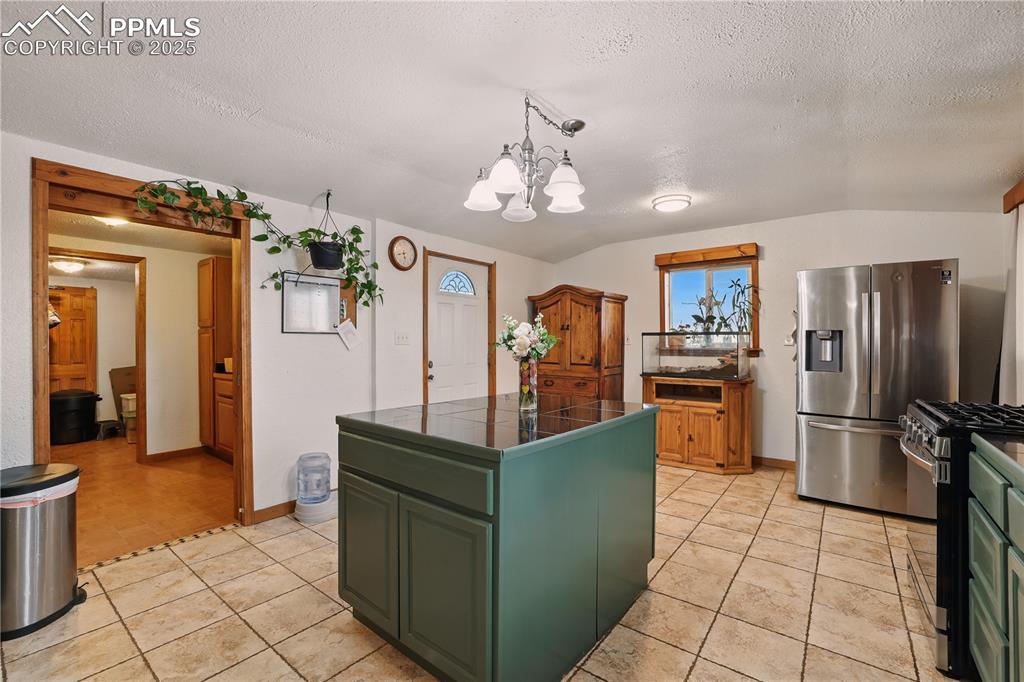 Image 14 of 50: Kitchen includes a pantry perfect for farm life.