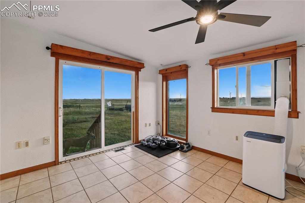 Image 18 of 50: This space offers flex and variety. Plenty of light to use as a sunroom. Ma
