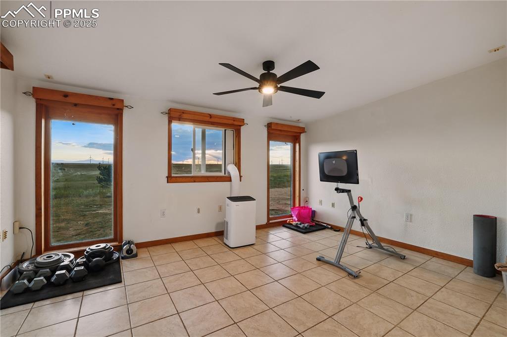 Image 19 of 50: The bonus/flex room is currently being used as an exercise room!