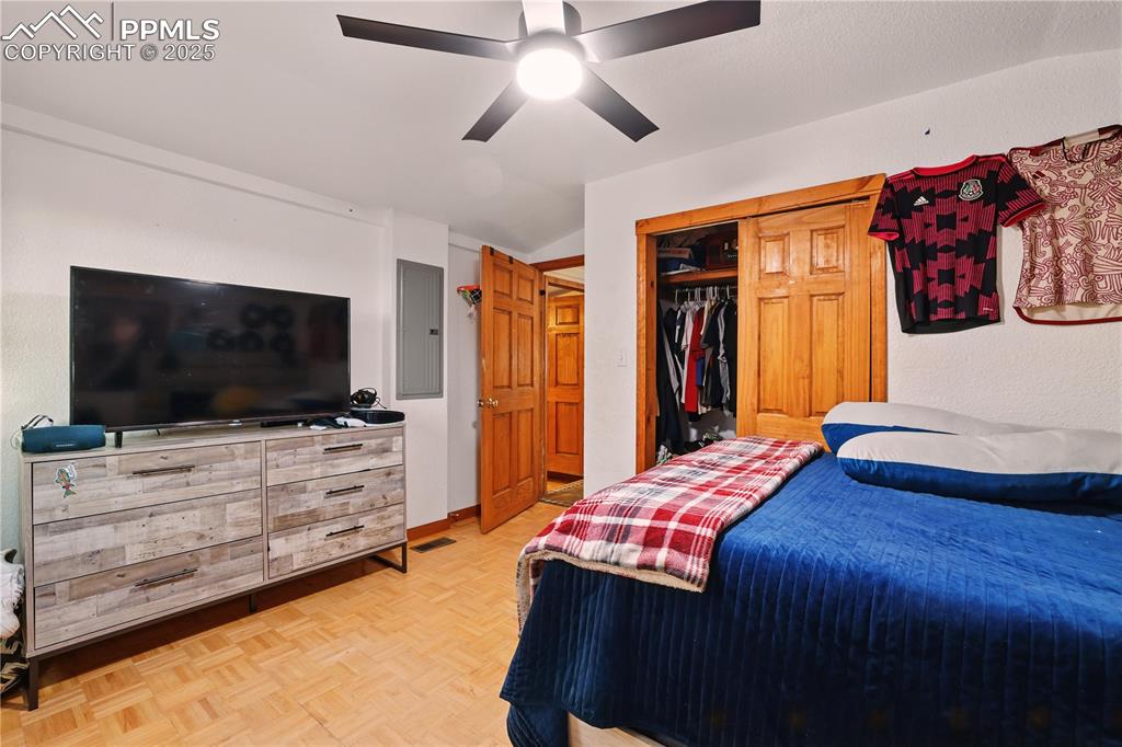 Image 32 of 50: Bedroom 3 features a ceiling fan and 5-panel wood doors.