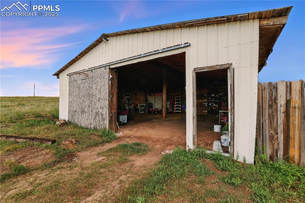 Image 43 of 50: Barn entrance, divided barn has animal space in the back half.
