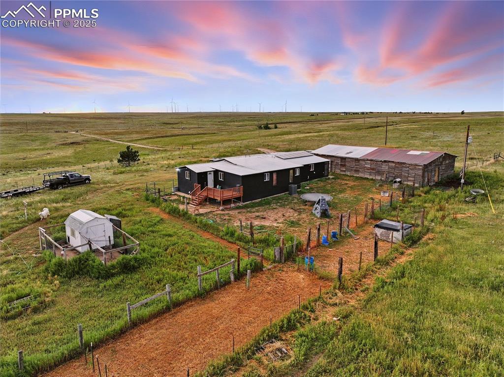 Image 48 of 50: Aerial view of backyard with seperate gardening area and pig pen.