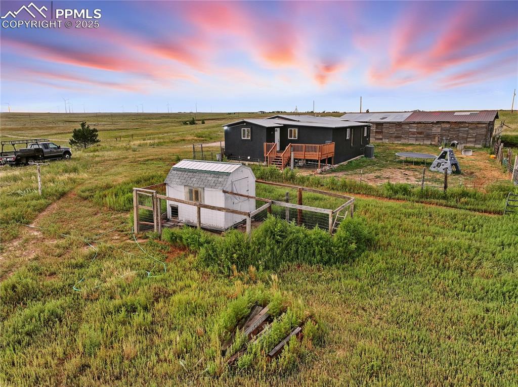 Image 49 of 50: Chicken coop conveniently located near backyard and garden.