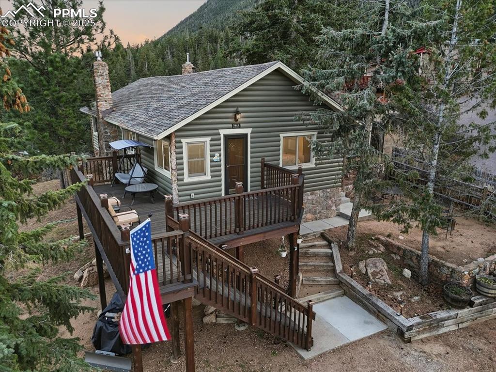 Caption: This dreamy log and stone cabin is just minutes to shopping and downtown Colorado Springs but feels 