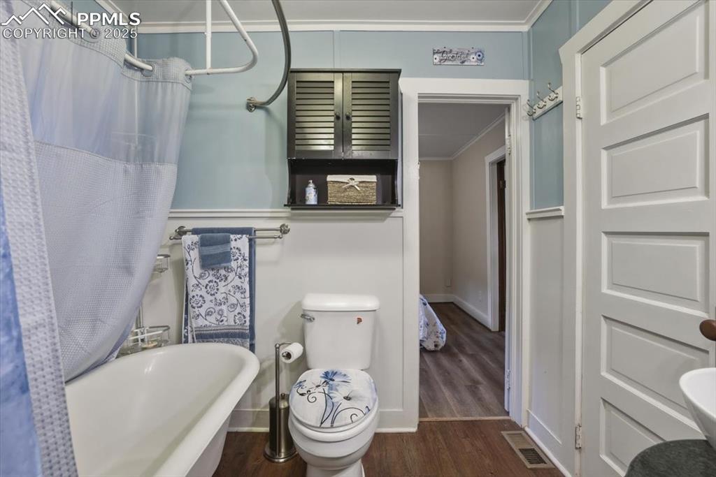 Image 20 of 47: Modern conveniences and vintage charm - this bathroom is the perfect mix of