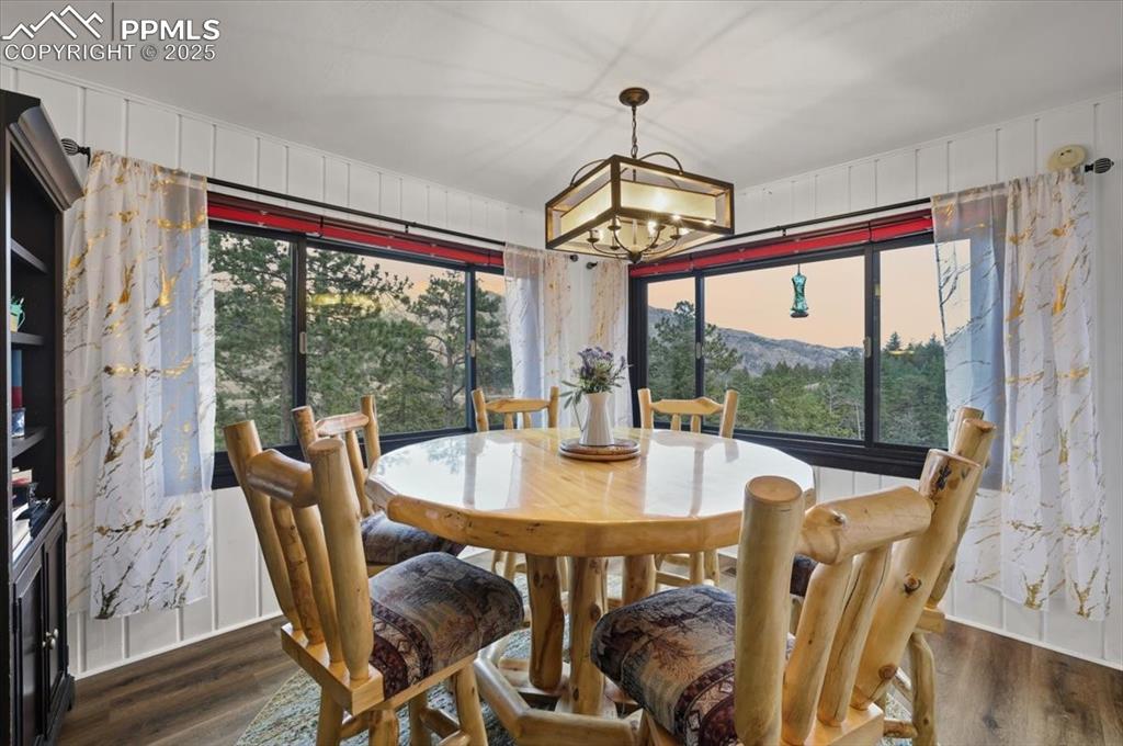 Image 22 of 47: The dining room is spacious and bright and takes in the amazing views aroun