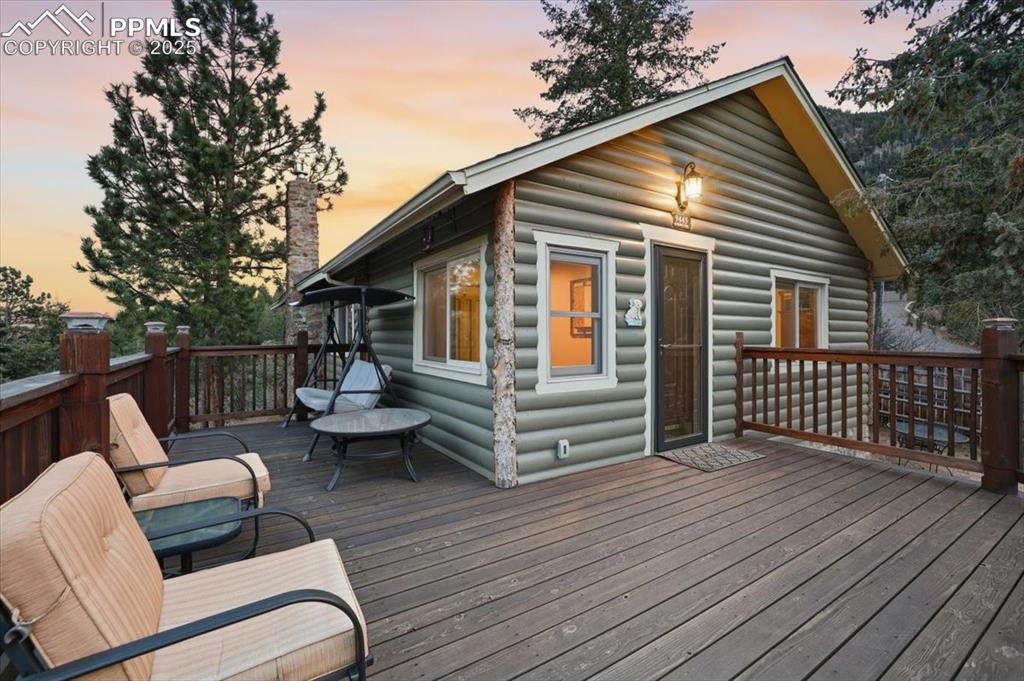 Image 3 of 47: The redwood front deck is newer and is the perfect place to watch the sunse