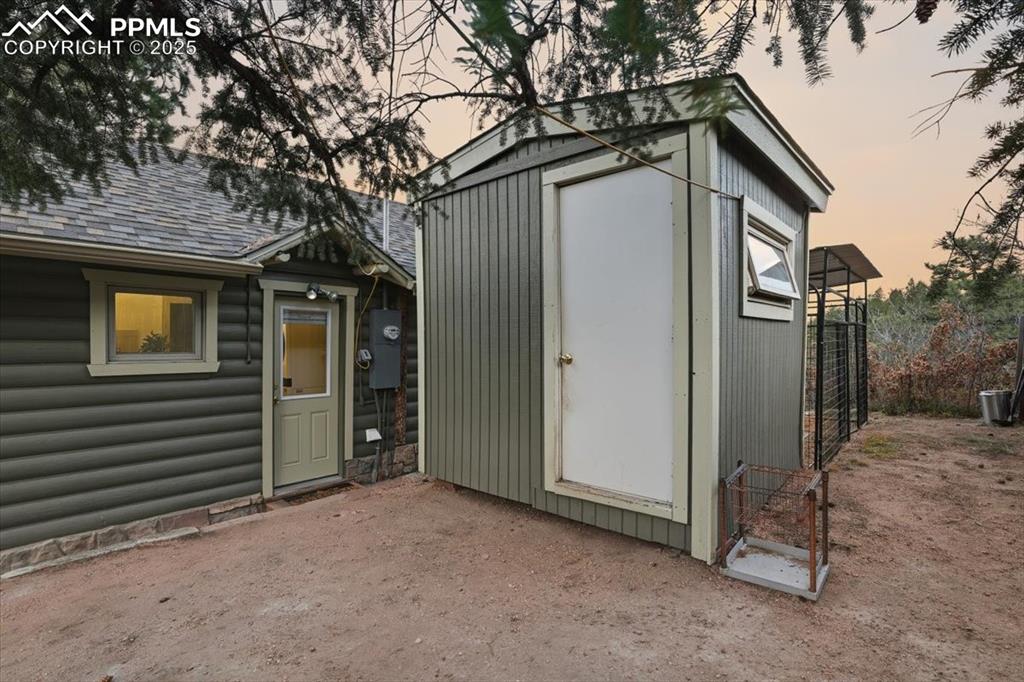 Image 32 of 47: This newer outbuilding is perfect for dogs, chickens or storage. 