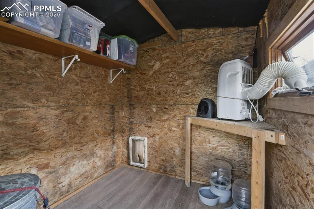 Image 33 of 47: This is the interior of the dog house/storage building. 