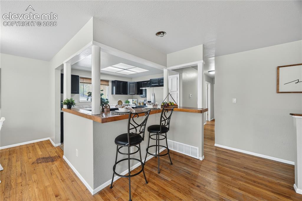 Image 10 of 34: Upper Level Living Room with front yard views.