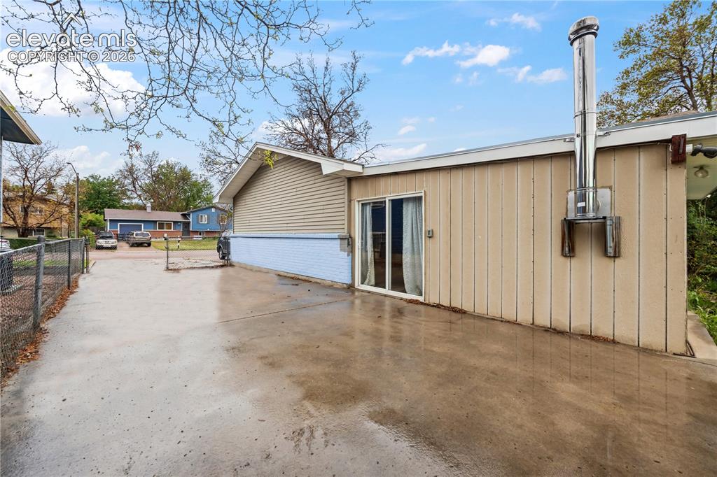 Image 3 of 34: Expanded driveway for plenty of off street parking in addition to the 1-car
