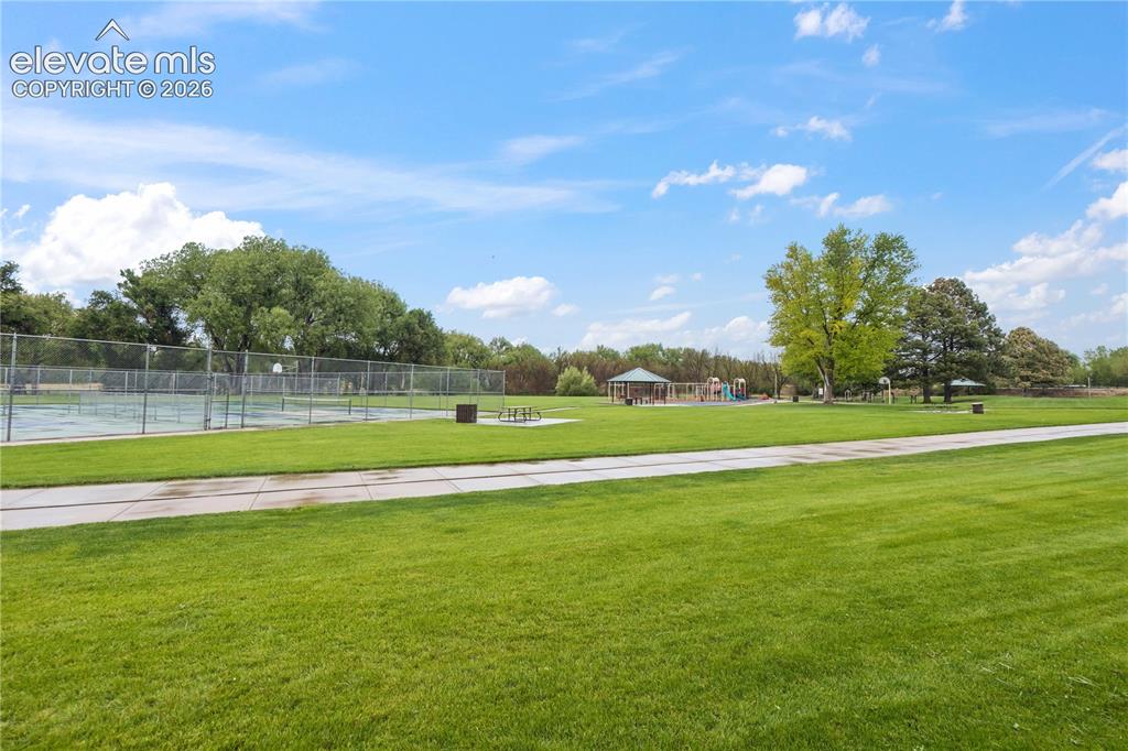 Image 33 of 34: The backyard backs to the 50 acre, Widefield Community Park.