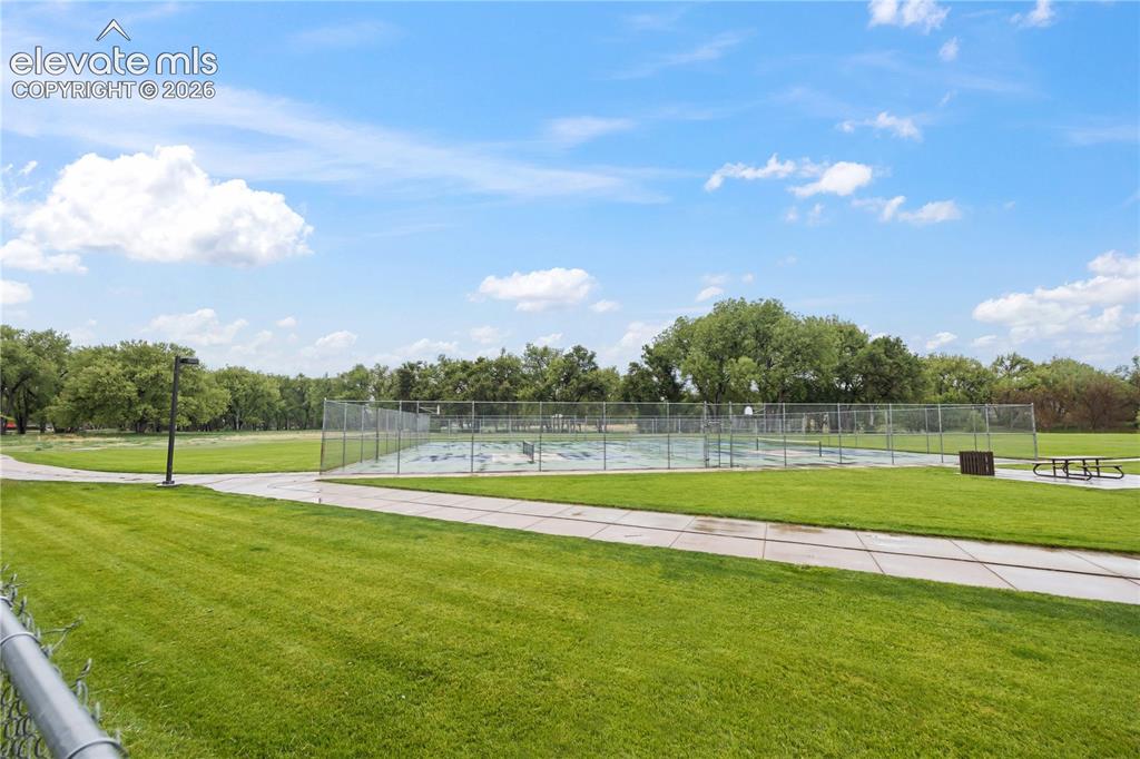 Image 34 of 34: Widefield Community Park features a playground, basketball court, baseball 