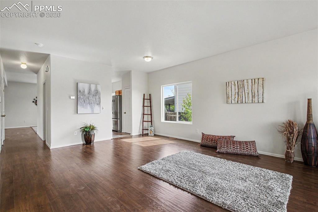 Image 3 of 40: Open-concept main level is brightened by fresh interior paint, abundant nat