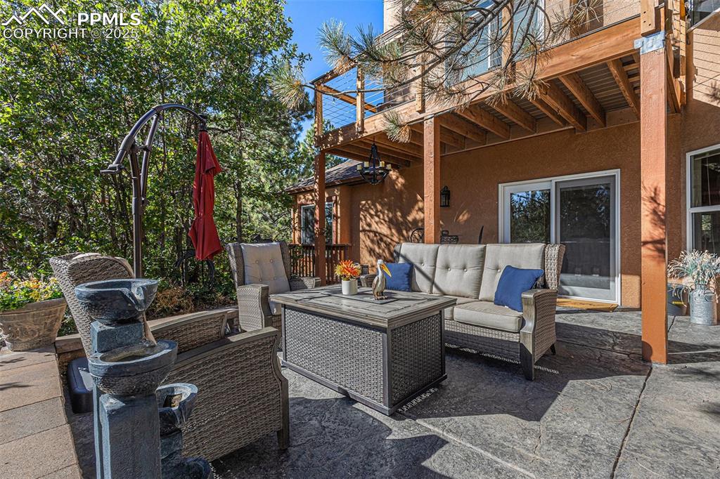 Image 15 of 47: View of patio featuring a hot tub and outdoor dining space