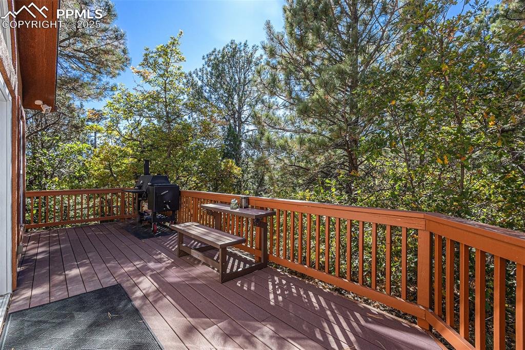 Image 17 of 47: Bedroom featuring vaulted ceiling, dark wood finished floors, multiple wind
