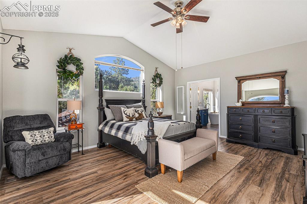 Image 18 of 47: Bedroom featuring dark wood-style floors, access to exterior, ceiling fan, 
