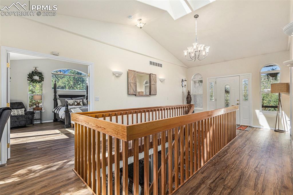 Image 26 of 47: View of front of house with a shed, stucco siding, concrete driveway, an at