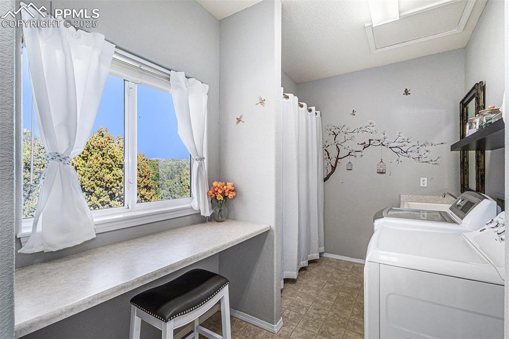Image 34 of 47: Carpeted bedroom featuring a ceiling fan, a wood stove, and a textured ceil