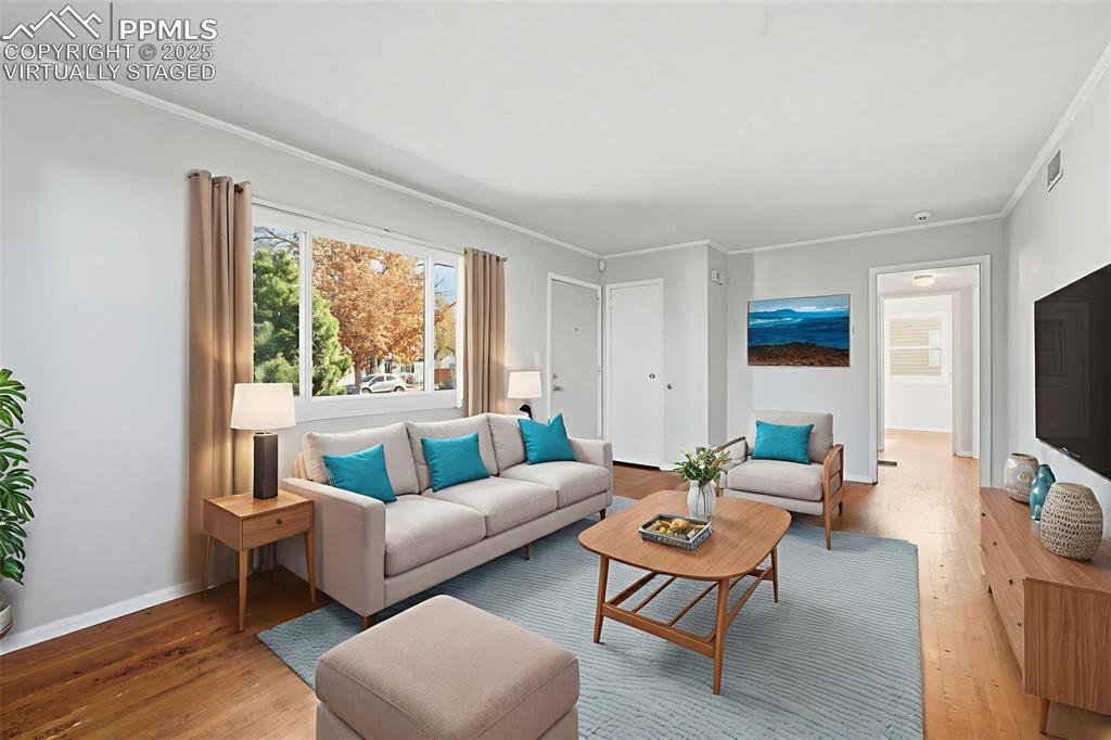 Image 16 of 50: Virtually Staged Living room 1 with wood floors