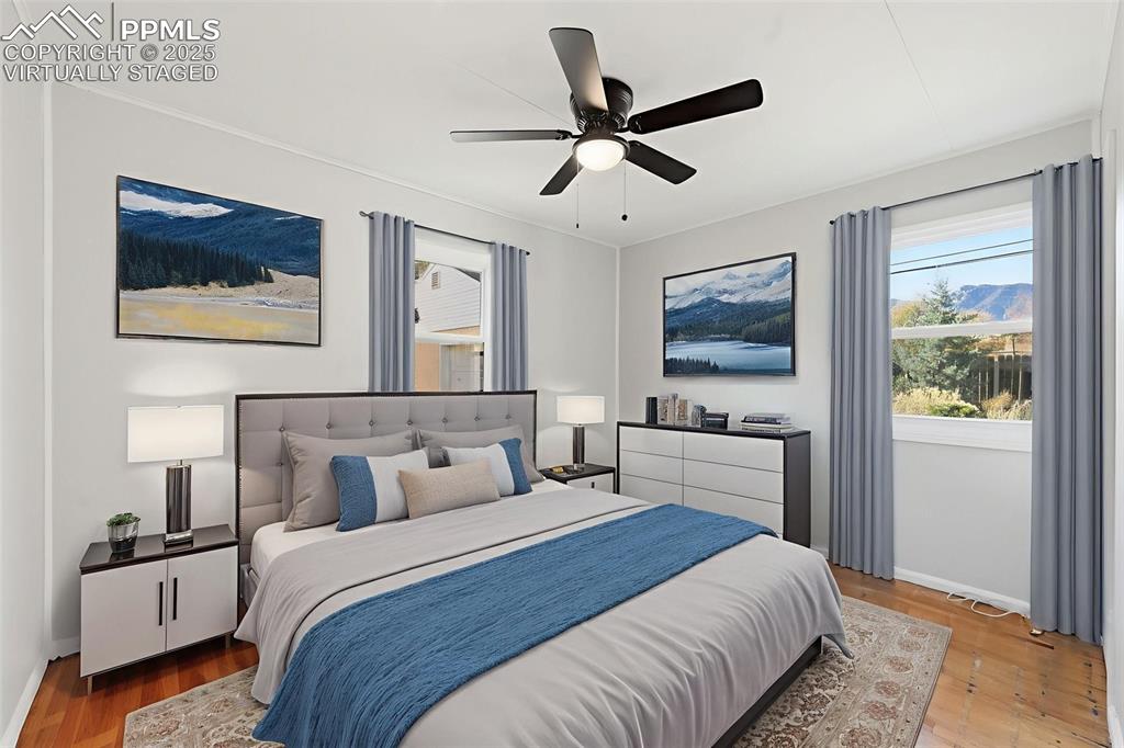 Image 31 of 50: Virtually Staged Bedroom 2 with ceiling fan