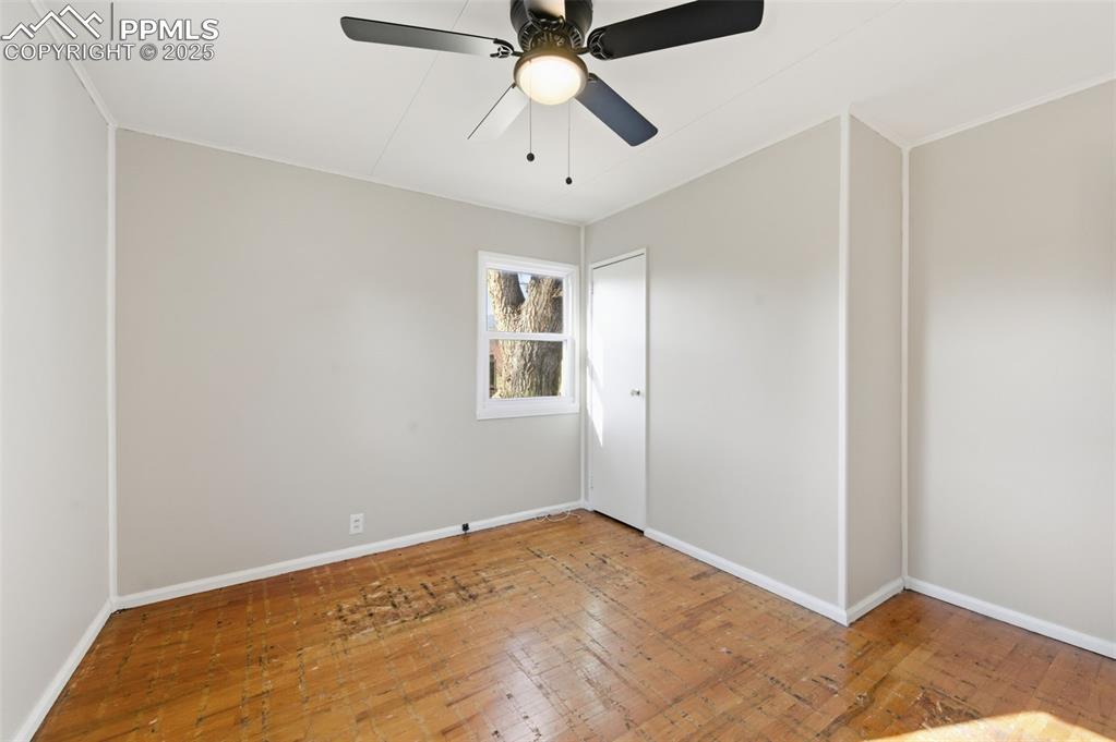 Image 34 of 50: Unfurnished room with a ceiling fan