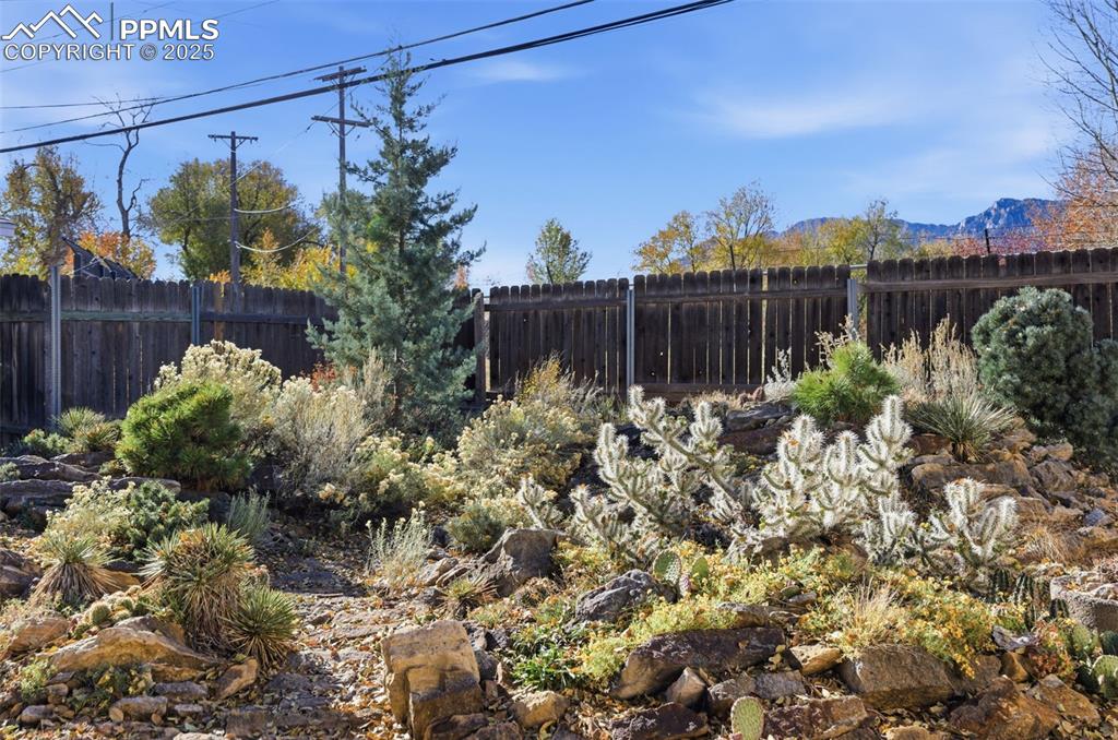 Image 43 of 50: View of fenced backyard