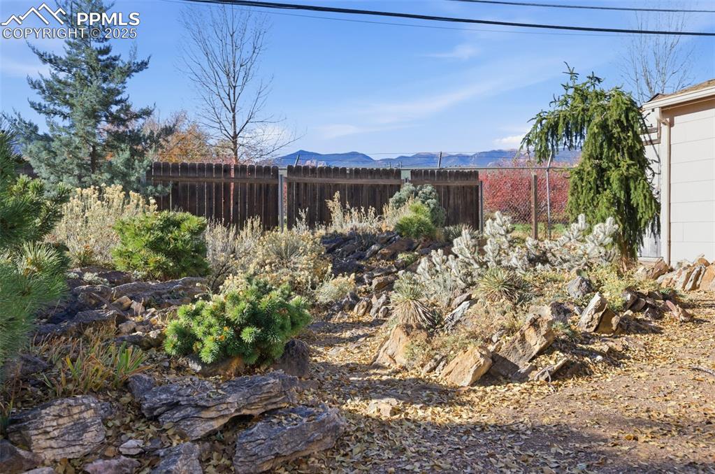 Image 45 of 50: View of yard with a mountain view
