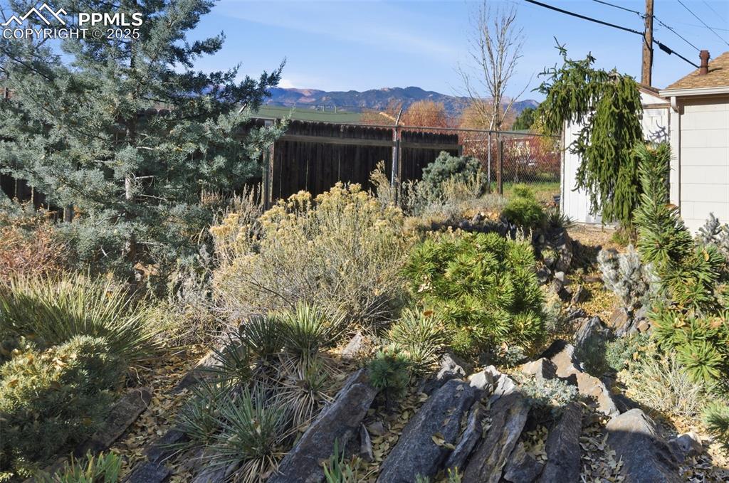Image 46 of 50: View of yard with a mountain view