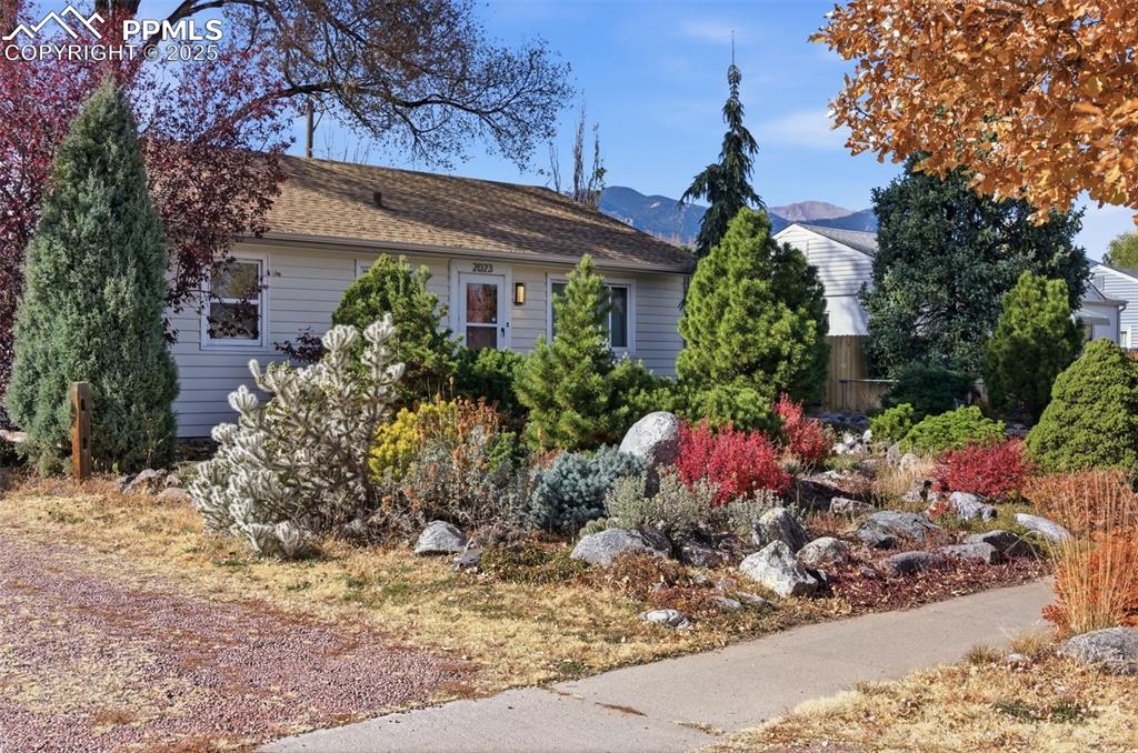 Image 6 of 50: View of front of home featuring a mountain view