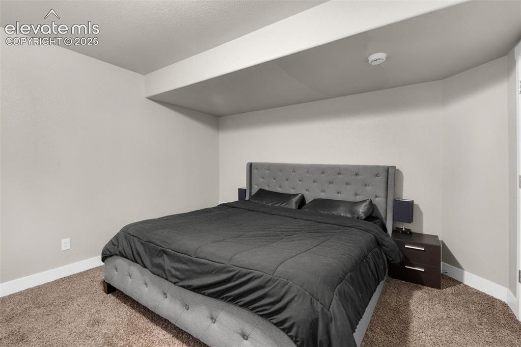 Image 37 of 49: Basement Bedroom