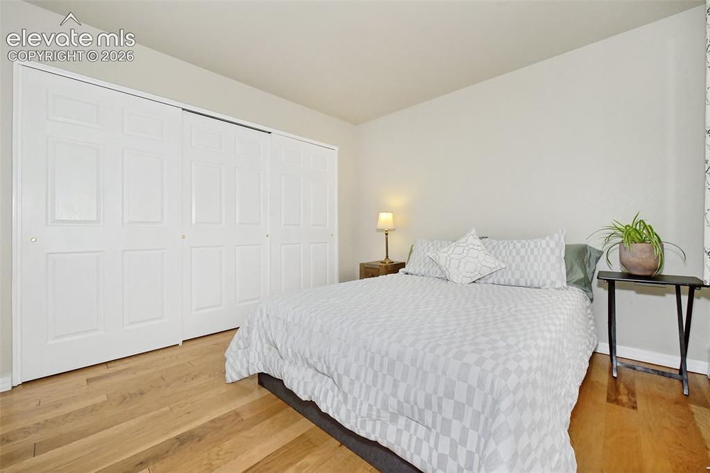 Image 12 of 22: first bedroom and closet