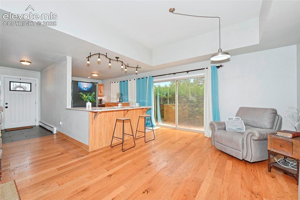 Image 2 of 22: Bright open concept living and dining