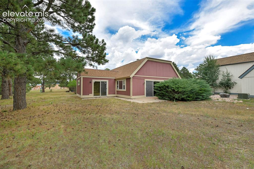 Image 5 of 22: rear exterior, trees and open setting