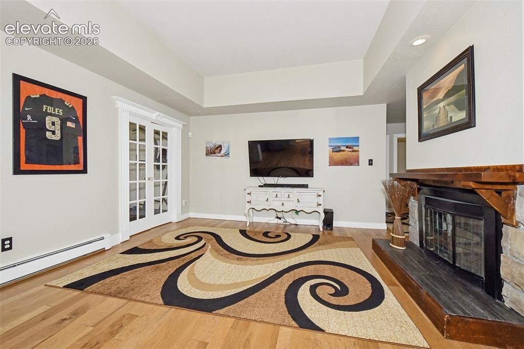 Image 7 of 22: Fireplace and french door
