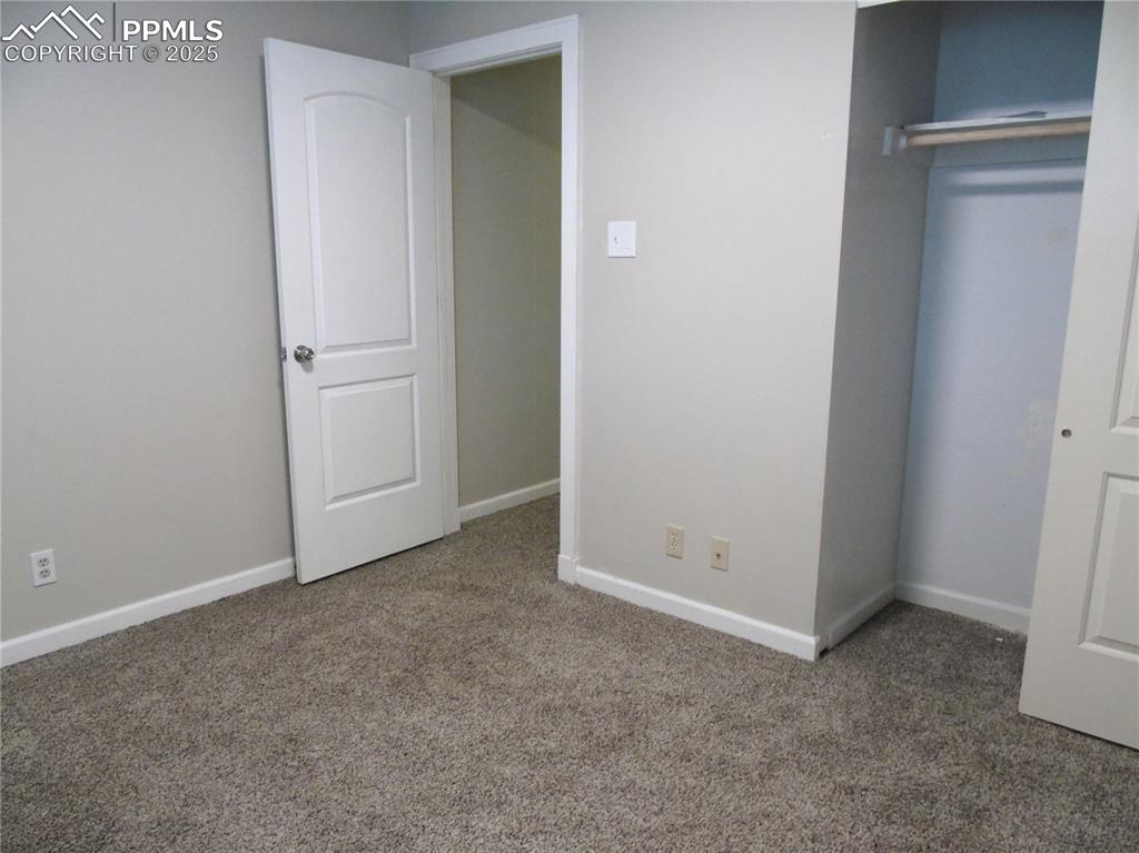Image 15 of 29: Unfurnished bedroom with carpet floors and a closet
