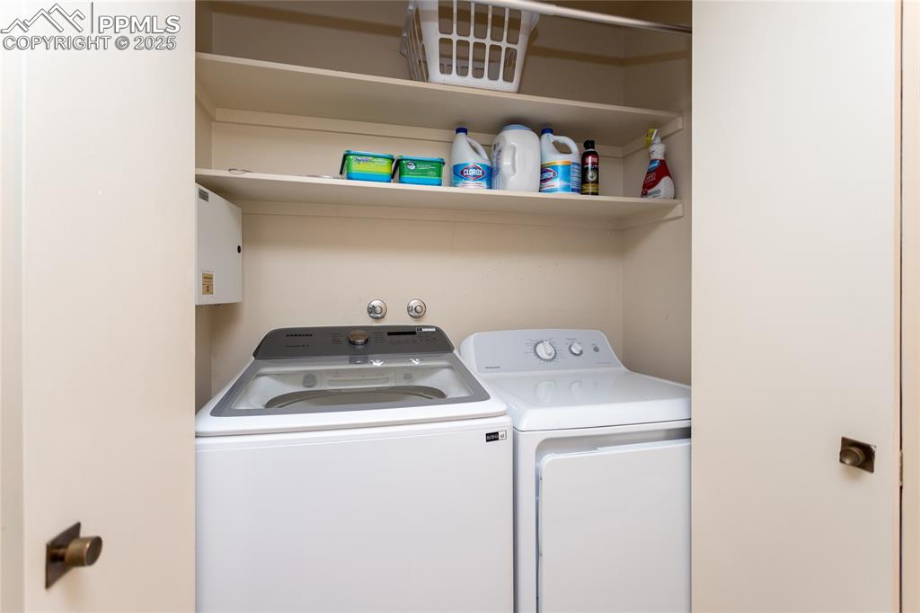Image 13 of 35: Laundry room with washing machine and clothes dryer