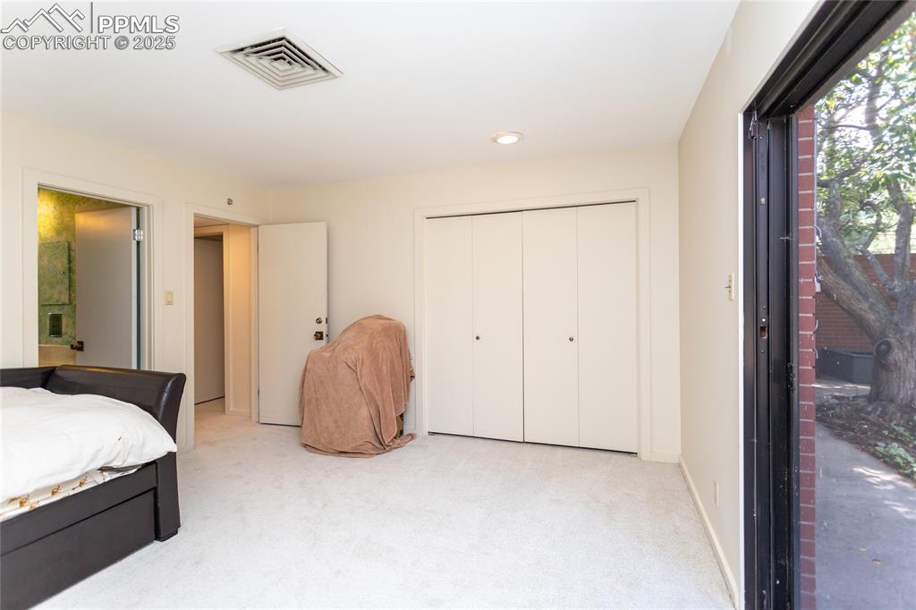 Image 21 of 35: Bedroom with carpet flooring, a closet, and recessed lighting