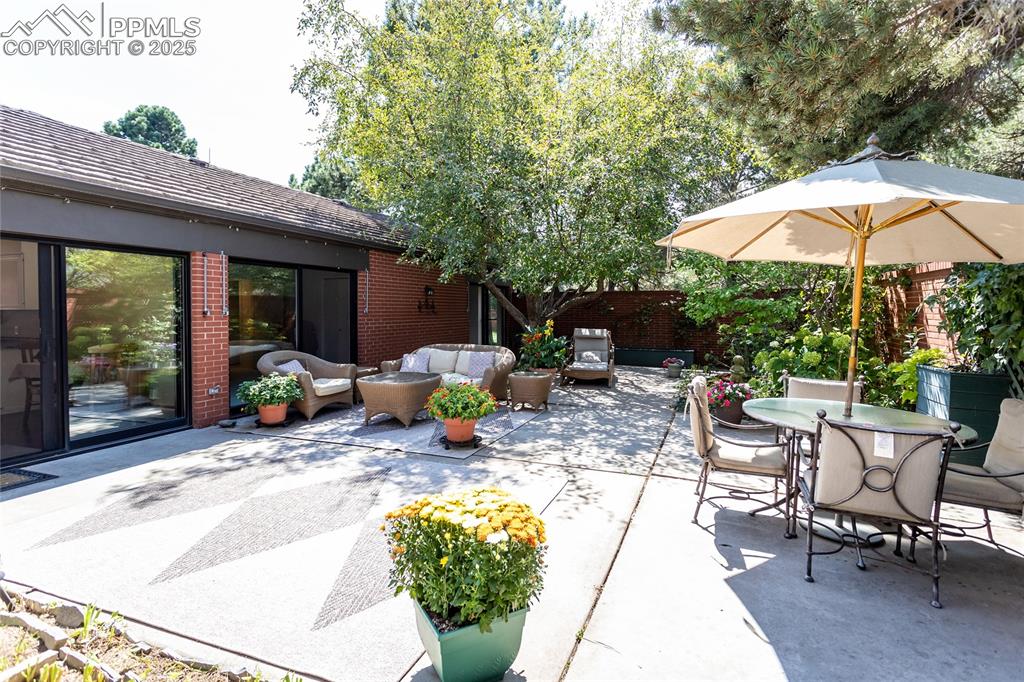 Image 30 of 35: View of patio featuring outdoor lounge area and outdoor dining area