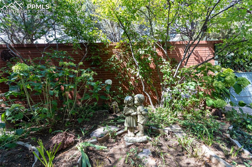Image 31 of 35: Quaint little garden inside the patio