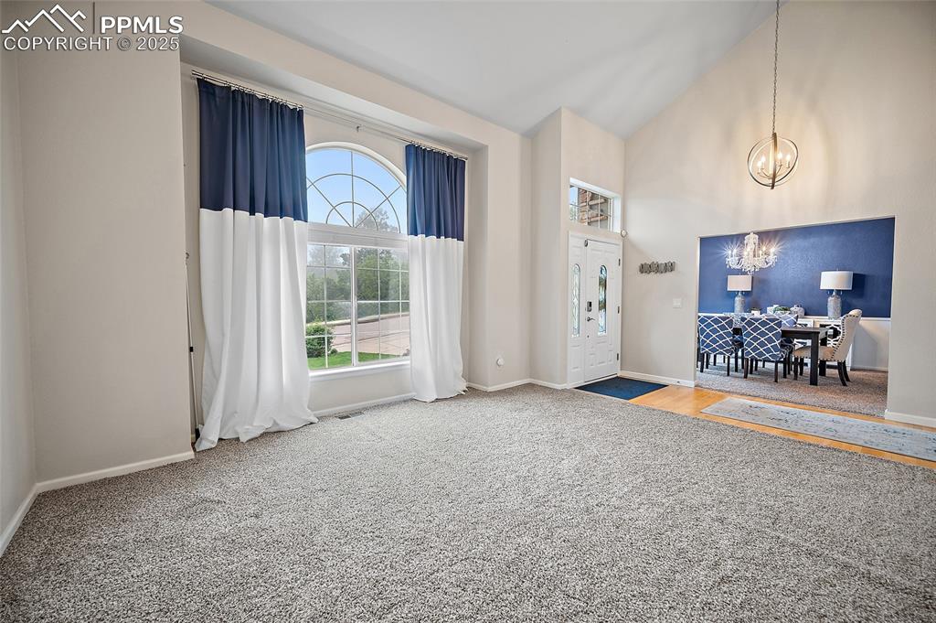 Image 20 of 50: Family room and entry