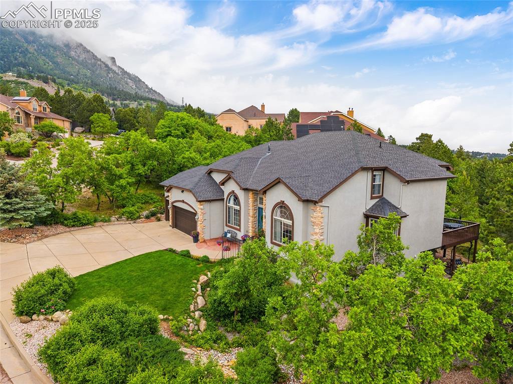 Image 3 of 50: French provincial home with stucco siding, concrete driveway, an attached g