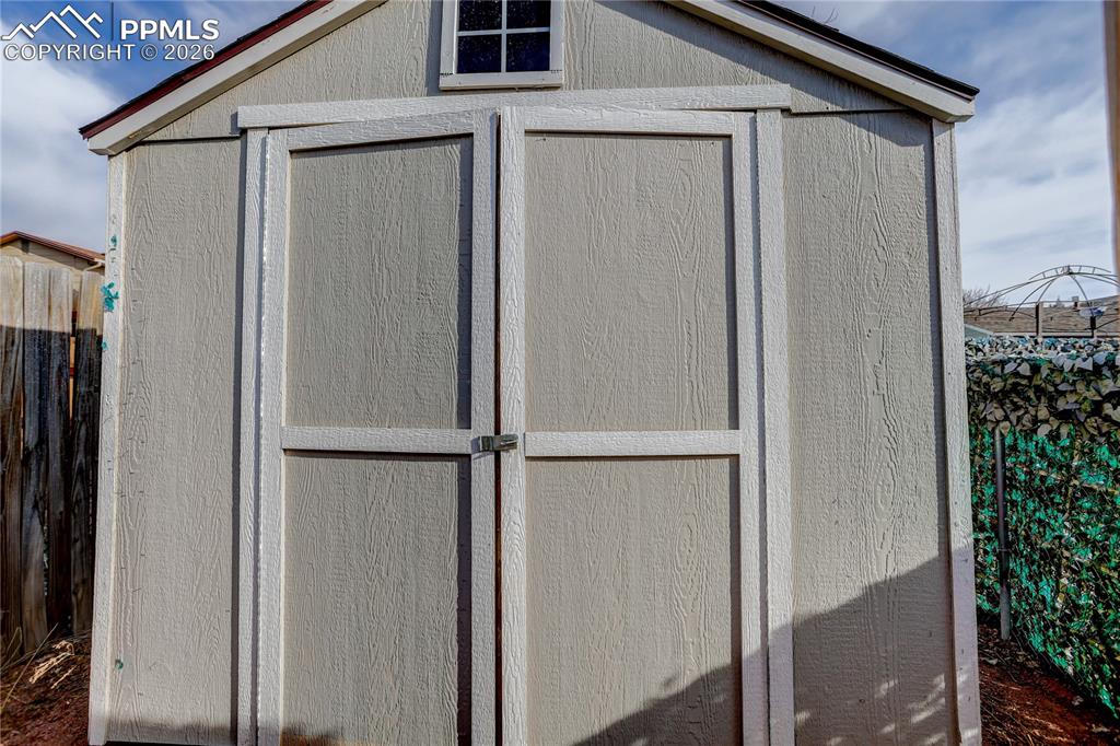 Image 13 of 16: Storage shed