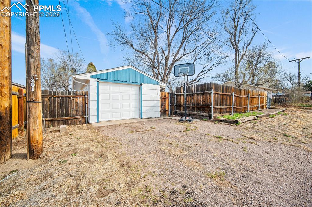 Image 31 of 38: Alley access to the detached garage.
