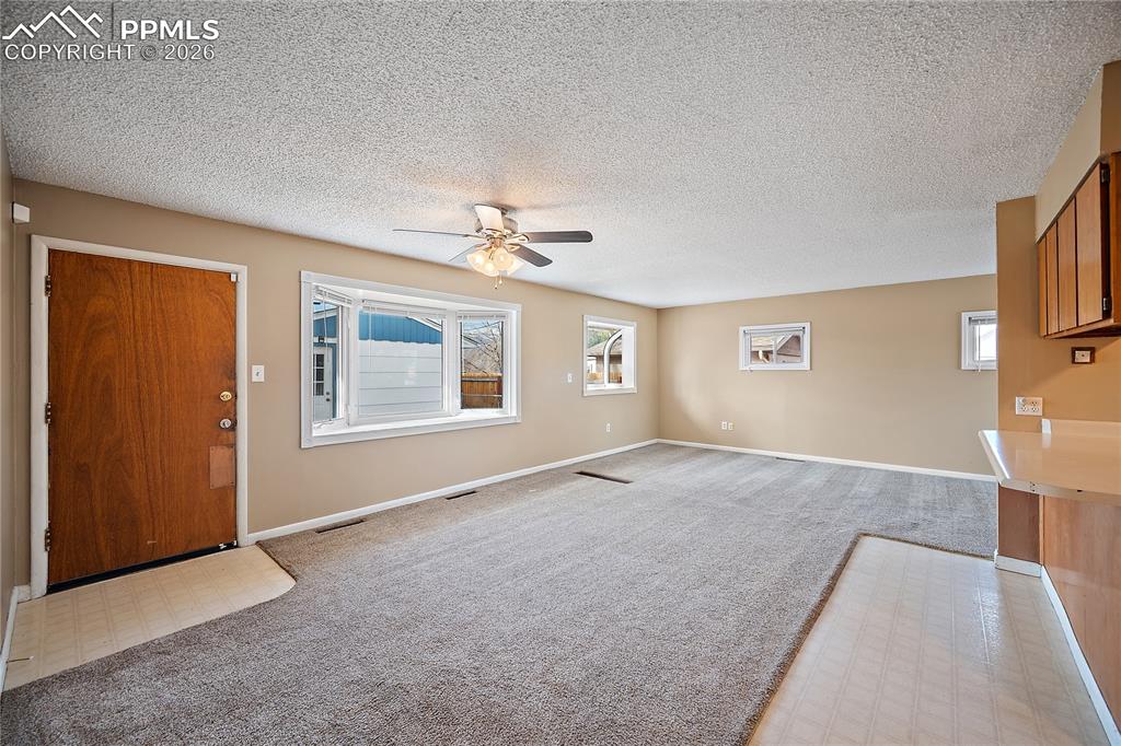 Image 9 of 38: Open to the kitchen and living space.