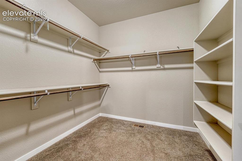 Image 12 of 43: Primary closet