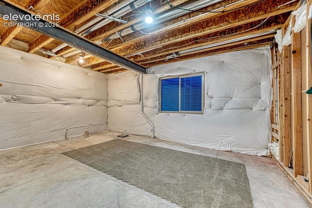 Image 31 of 43: Unfinished area for storage OR ready to be finished for an extra bedroom an