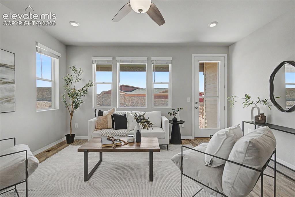 Image 18 of 45: Living area featuring wood-finish flooring, recessed lighting, and a ceilin